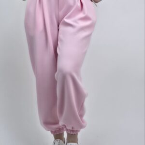 Spodnie pumpki masełkowe z guzikiem, kolor jasny róż